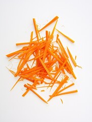 Shredded carrot strips on clean white background