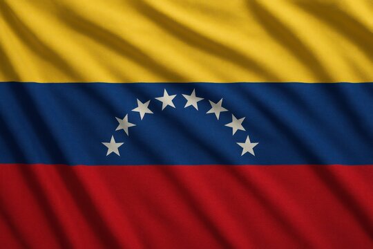 A detailed close-up of the Venezuelan national flag featuring yellow, blue, and red stripes with stars.
Concept of: Venezuelan identity.