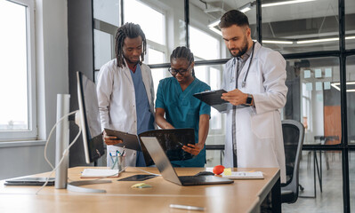Busy by working with documents. Doctors are in the office
