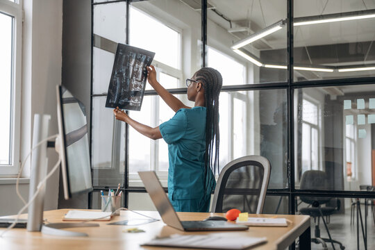 Female doctor in coat is in the office clinic - Powered by Adobe