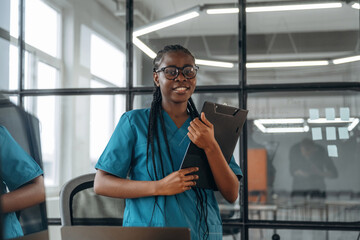 In the office clinic. Female doctor in coat