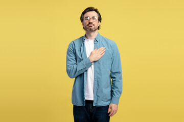 Honest man making an oath with hand on chest