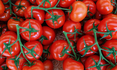 Tomatoes on market background top view