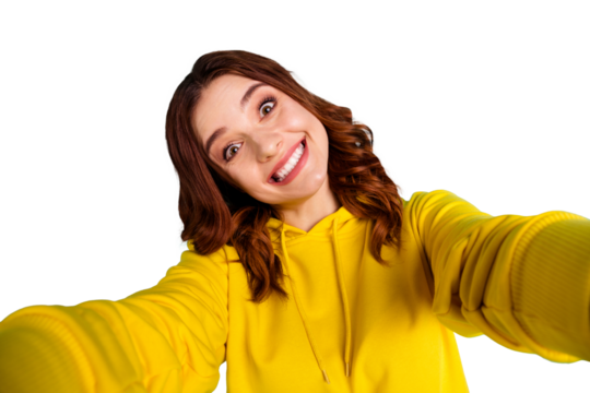 Photo of trendy cute cheerful nice millennial smiling toothily showing teeth with face expression of joyfulness while taking selfie isolated over teal vivid color background
