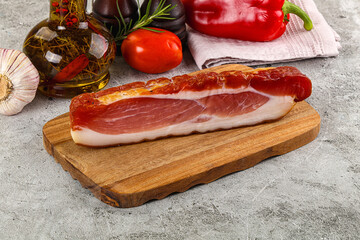 Piece prosciutto crudo over board