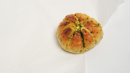A close-up shot of freshly baked Korean cream cheese garlic bread, showcasing its soft, golden-brown exterior and the generous filling of creamy cheese and fragrant garlic butter.
