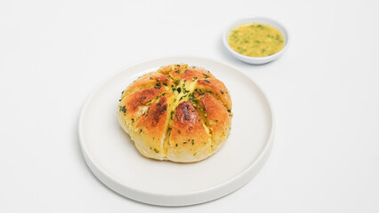 A close-up shot of freshly baked Korean cream cheese garlic bread, showcasing its soft, golden-brown exterior and the generous filling of creamy cheese and fragrant garlic butter.