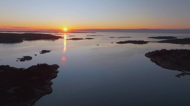 Str&ouml;mstad Stromstad Sweden aerial drone Arctic Circle islands golden sunset sun on horizon peaceful calm still Sandelfjord Fjord Baltic Sea marina harbor picturesque seaside pan right