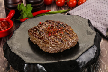 Grilled beef burger cutlet with sauce
