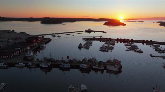 Str&ouml;mstad Stromstad Sweden aerial drone boat trolling arctic golden sunset sun on horizon Sandelfjord Fjord Baltic Sea Seaside Town marina harbor picturesque Koster islands Oscarspromenaden forward