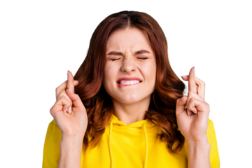 Close up photo of scared terrified firghtened youngster anticipating with fingers crossed eyes shut closed biting lips wearing yellow hoodie isolated turquoise vibrant color background