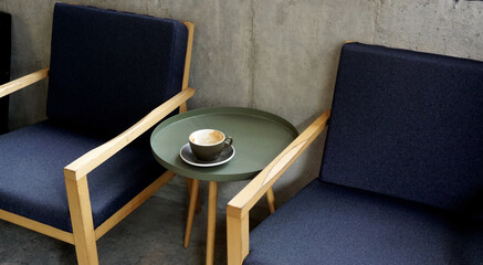 Empty coffee cup on steel table in cafe