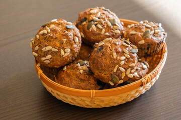  healthy muffins topped with a mix of seeds, perfect for a grab-and-go breakfast