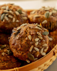  healthy muffins topped with a mix of seeds, perfect for a grab-and-go breakfast