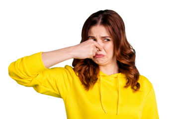 Photo of disgusted girl smelling something bad nasty looking shutting her nose isolated over vivid turquoise color background