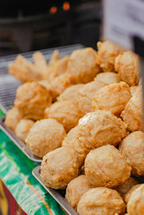 cooking fried meatballs directly in a hot frying pan, Fried meatballs are street food