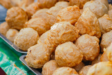 cooking fried meatballs directly in a hot frying pan, Fried meatballs are street food