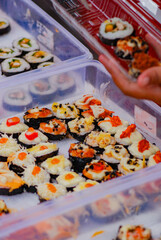 Sushi roll with fish, shrimp sushi in white box, Traditional Japanese colorful vegetables