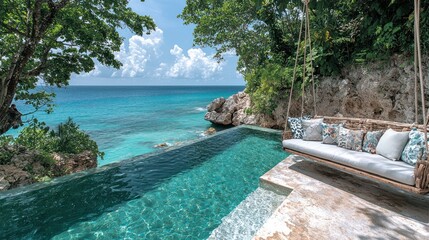 Obraz premium Infinity pool overlooking turquoise ocean, cliffside swing.