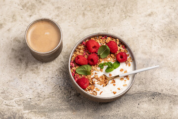 yogurt with granola and raspberries, breakfast
