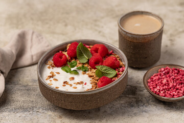 yogurt with granola and raspberries, breakfast