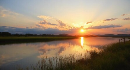 Naklejka premium Sunset with golden light over nature in summer evening.