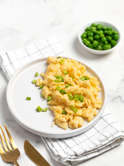 Plate of tasty scrambled eggs, breakfast