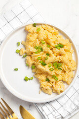 Plate of tasty scrambled eggs, breakfast