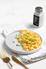 Plate of tasty scrambled eggs, breakfast