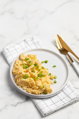 Plate of tasty scrambled eggs, breakfast