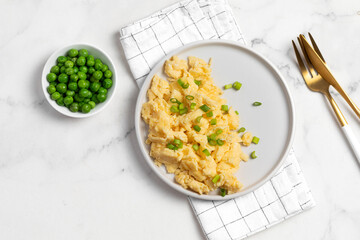 Plate of tasty scrambled eggs, breakfast
