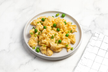 Plate of tasty scrambled eggs, breakfast