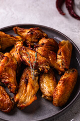 Baked roasted chicken wings with sauce