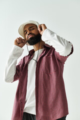 Stylish young man showing off his fashion sense in a modern indoor setting