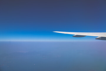 Wing Against a Stunning High-Altitude Blue Sky Horizon