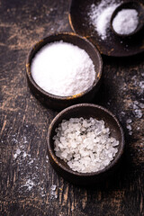 Natural sea salt crystals on dark background