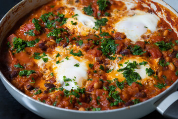 eggs and beans dinner in a pan close-up