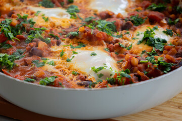 eggs and beans dinner in a pan close-up