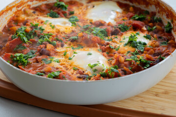 eggs and beans dinner in a pan close-up