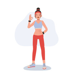 Happy athletic woman in stylish sportswear making okay gesture for gym and wellness inspiration