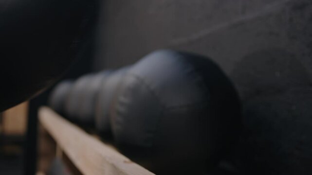 Hands Grabbing 4kg Medicine Ball For Workout Session. closeup shot