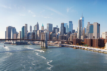 A panoramic view of the Brooklyn Bridge stretching towards Manhattan