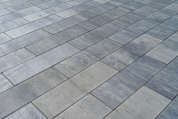 Gray concrete paving, big cement bricks street tiles background