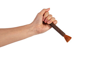 Hand using a little paintbrush isolated on a transparent background