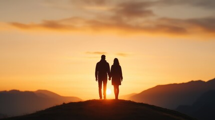 Couple Holding Hands Against Sunset Horizon in Romantic Landscape