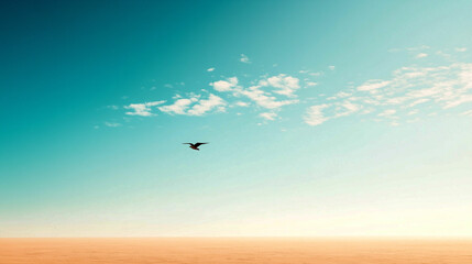 Fototapeta premium Bird soaring in a clear blue sky over a vast horizon during daylight