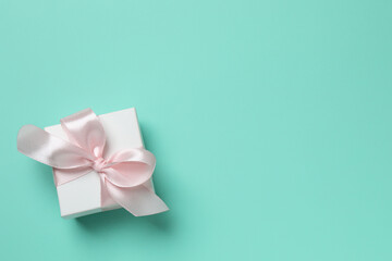 Beautiful gift box on color background