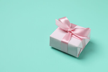 Beautiful gift box on color background