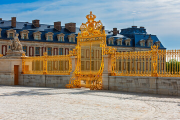 The Royal Gate of the Palace of Versailles. Honor Gate. Gold gilded gate to the entrance of the Royal Courtyard.