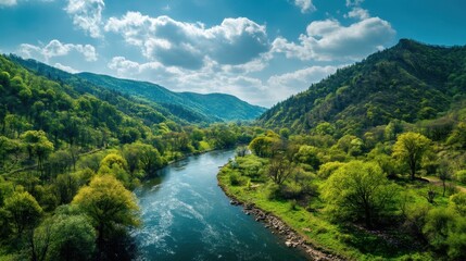 stunning natural landscape with green hills, clean river and blue sky, peaceful spring environment, no people, Earth Day concept 